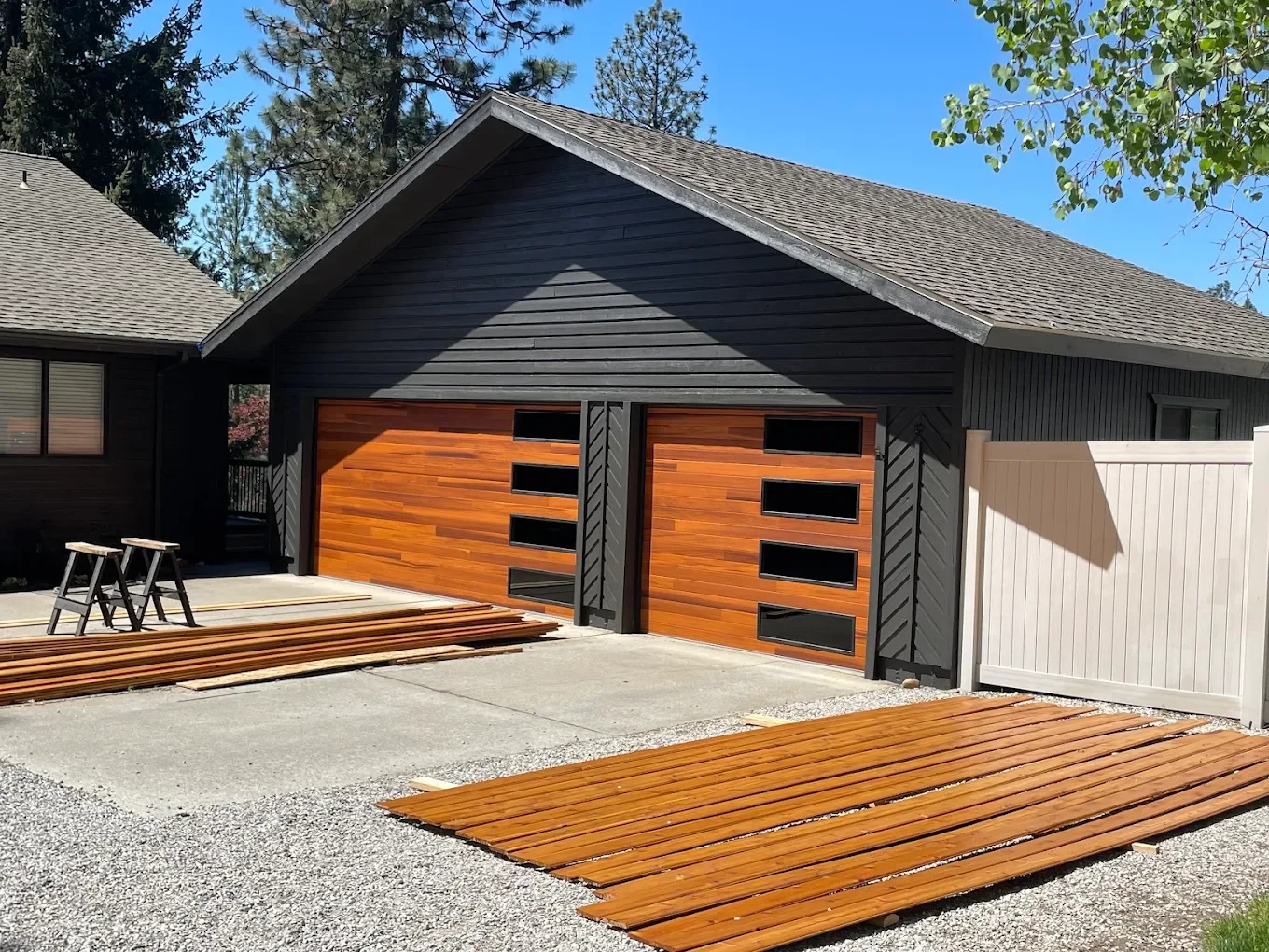 Modern wood-look garage doors installed by Overhead Door Company in the Coeur d'Alene area