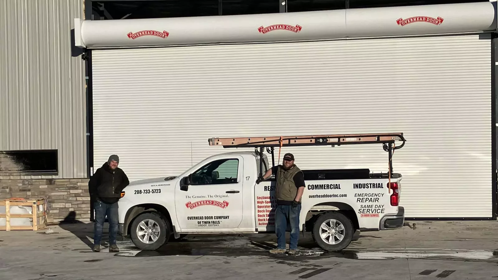 Overhead Door Company of Twin Falls crew and service truck in front of a commercial door