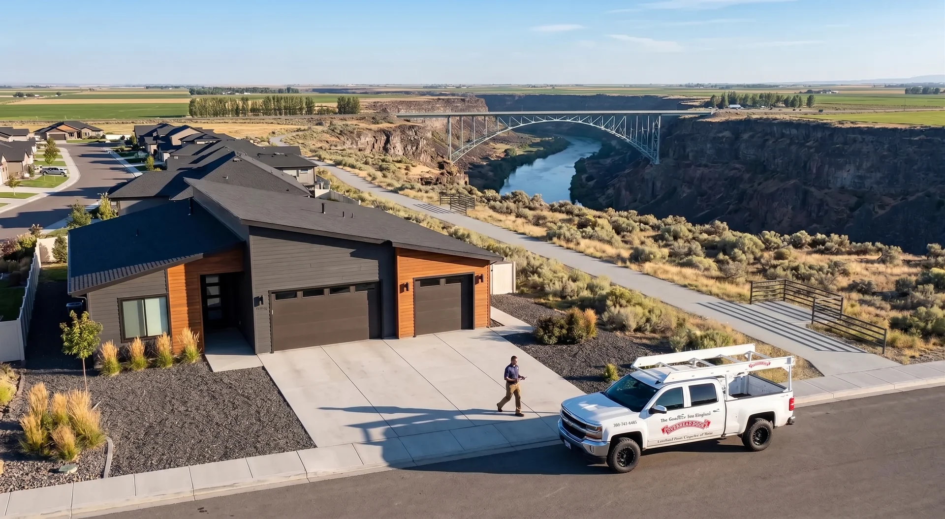Overhead Door Company technician and service truck at a Twin Falls home near the Perrine Bridge and Snake River Canyon